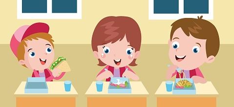 Three elementary school students having lunch together in the school canteen