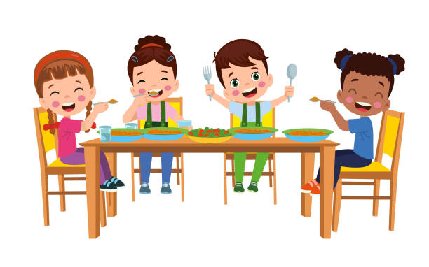 cute little boy eating at the dinner table